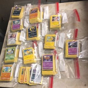Stacks of 100 normal Pokémon cards